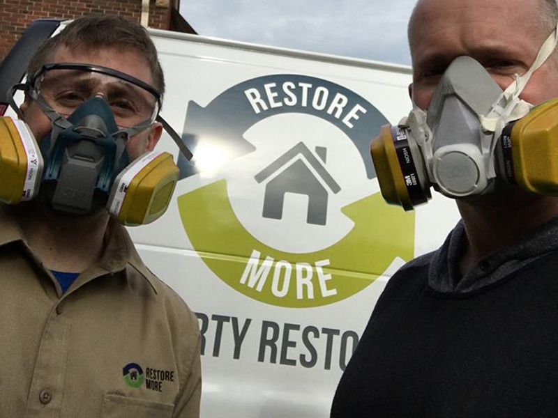 RestoreMore Inc workers outside of truck